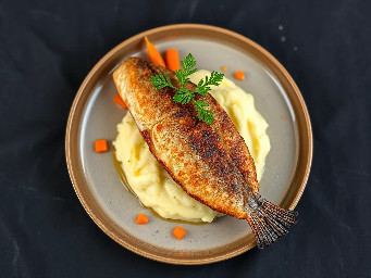 Deep fried blue catfish fillet with mashed potatoes and sautéed carrots
